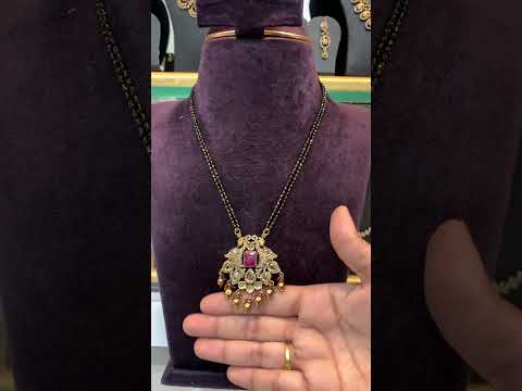 Beautiful two layer black beads chain with pink stone and peacock design pendant